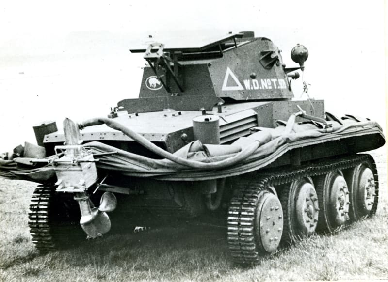 A small tank vehicle with tubing around the edges.