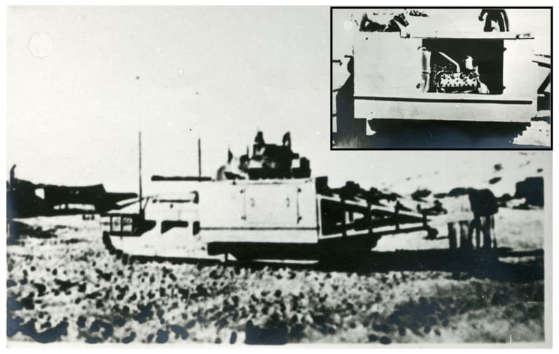 Out of focus black and white photograph of a side view of a flail tank, tank with rotating attachment at front with chains attached. Another photo is inset in top right corner appearing to show the back view of the same tank.