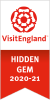red and white rose on white and red banner, reads visit england hidden gem 2020-21