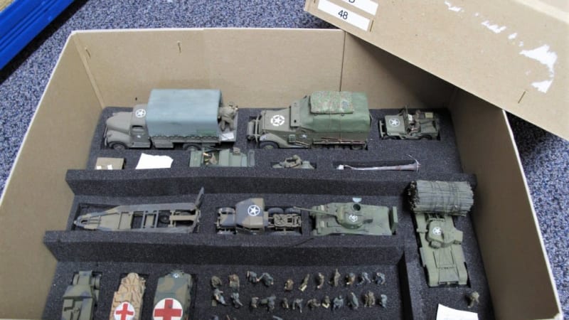 A variety of scale model vehicles properly packed in a box