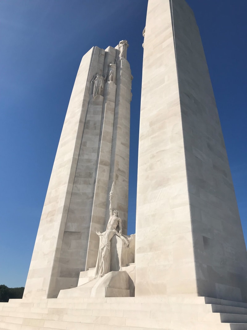 The Vimy Memorial, which is two tall white columns with sculpted figures in the middle.