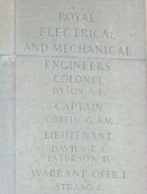 A grey stone wall panel with names engraved