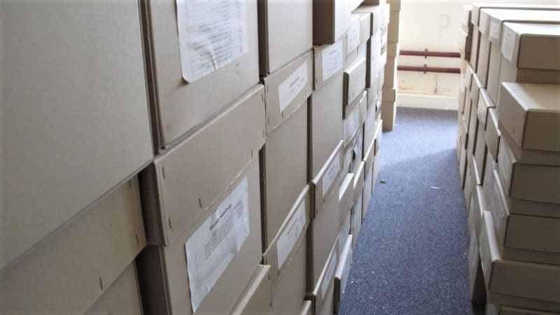 A room filled with many boxes waiting to be processed