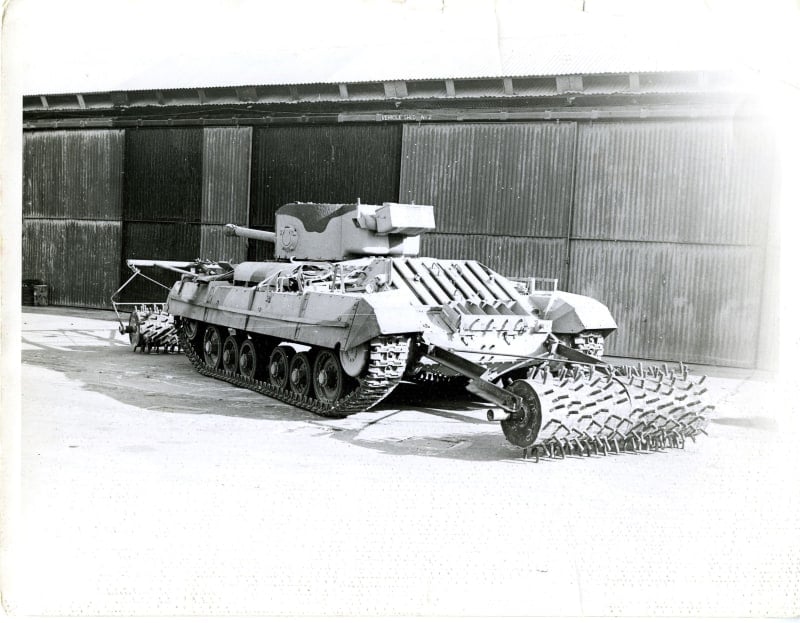 Image shows a tank with spikey rollers attached to both the front and back.