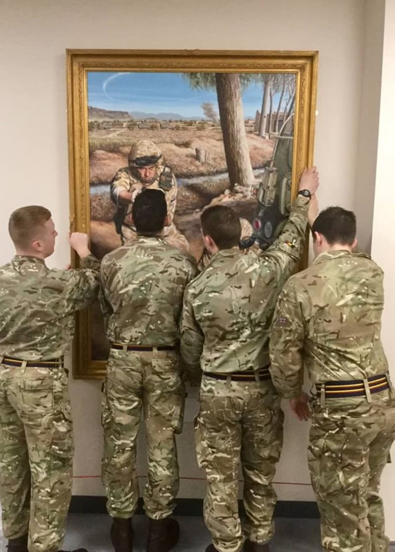 Soldiers from 8 Training Battalion REME helped hang the gallantry paintings.